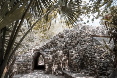Maya ruins at Coba standing among the jungle trees