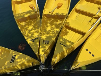 Canoe gliding across a large open-air cenote