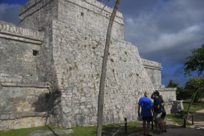 Guests on a private tour walking through the Tulum ruins