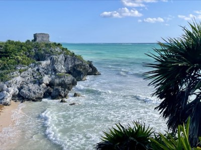 Maya structures at Tulum under an open blue sky