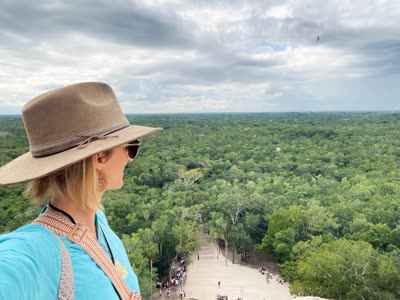 Kat looking out over the Coba jungle from the top of the pyramid