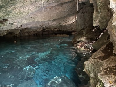 Still, mirror-clear water deep inside a cave cenote